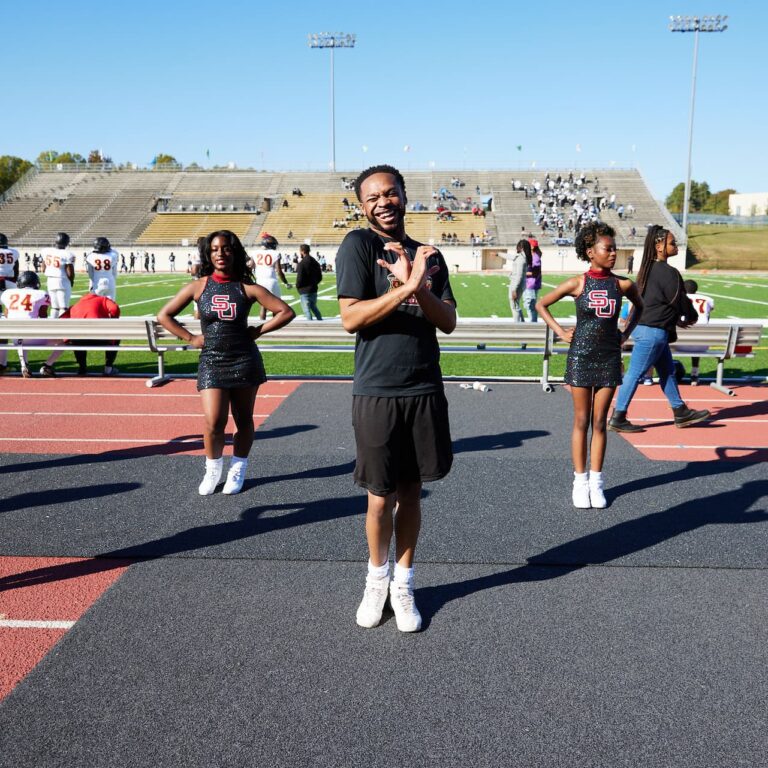 Students cheering on the sidelines