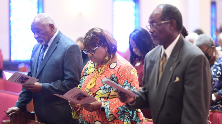 Community members in church service