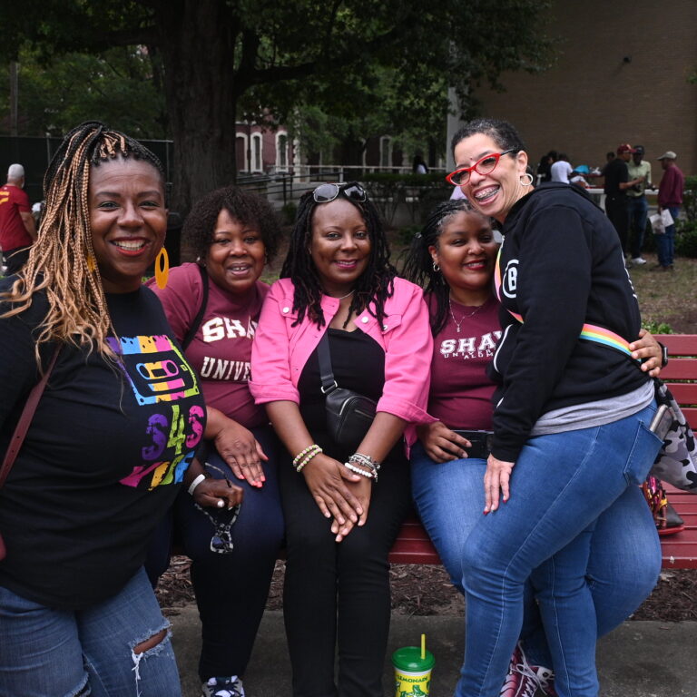 Group of adults and students outside