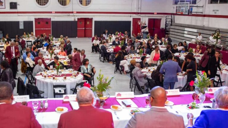 Group of people gathered at tables at a banquet hall